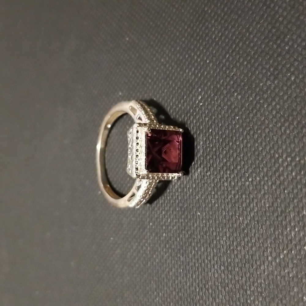 Sterling silver ring with purple colored stone